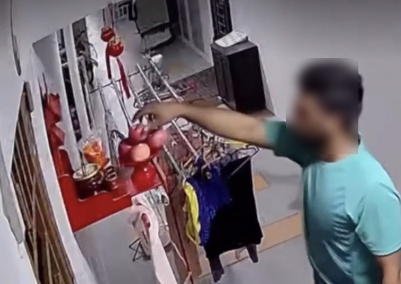 'At least he asked for permission': Man filmed taking altar offerings along HDB corridor