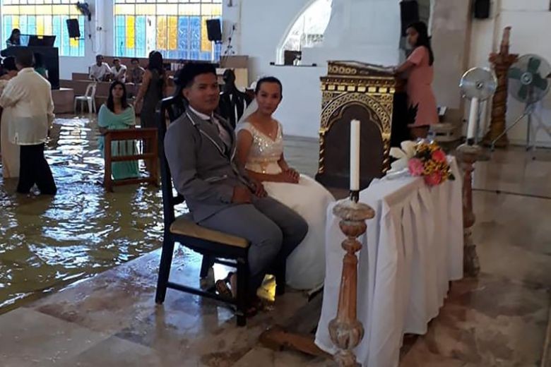 For wetter or worse: Filipino bride defies storm to get married