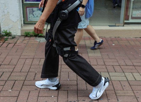 Robotic legs help elderly Hong Kong fire survivors climb back for belongings