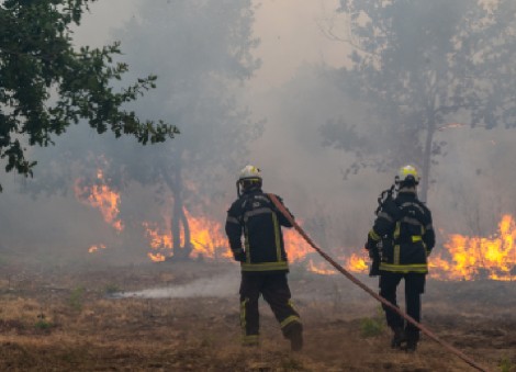 France and Spain battle wildfires as more than 250,000 people are forced to flee homes