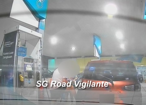 Baby in car? Man seen rocking Singapore-registered car while pumping petrol in Malaysia
