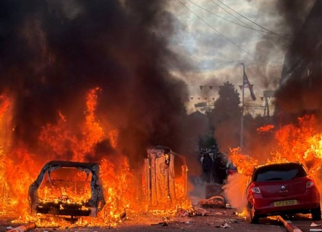 Police blast water cannons at Belfast protesters as unrest flares again after stabbing