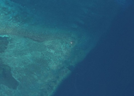 Satellite images show suspected structure at disputed South China Sea atoll, but later gone