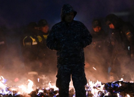 Residents protest as authorities burn cash left on ground by Bolivian plane crash