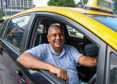 Singapore's last 5 yellow-top taxi drivers near the end of the road