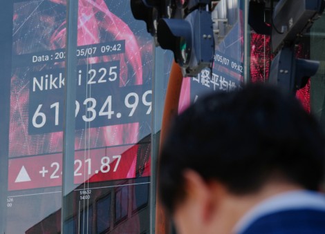 Asian shares mostly gain and oil prices fall after Trump says peace talks on Iran war are proceeding