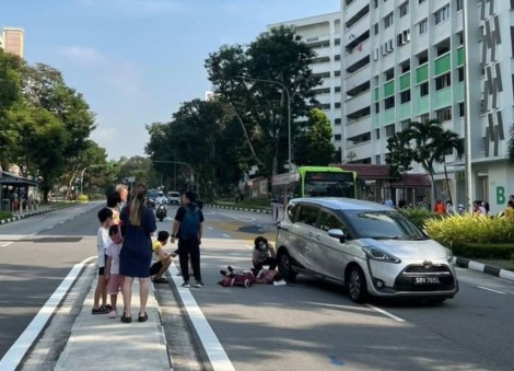 Elderly woman left bleeding on road after car crash in Yishun