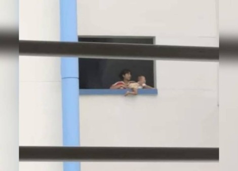 Police investigating after woman caught placing baby on HDB ledge