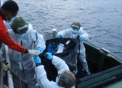 Rescuers pull more bodies from burned Philippine ferry as death toll hits 76