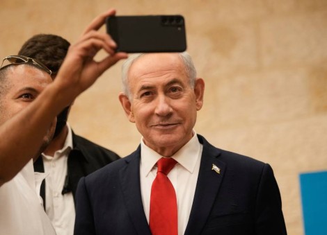 With his eye on re-election, Israel's Netanyahu turns his focus to his divided base 