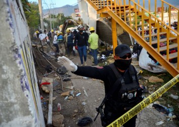 At least 49 people, mostly migrants, killed in Mexico trailer road accident