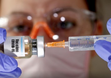 WHO vaccine plan faces big problem: Who pays if things go wrong?