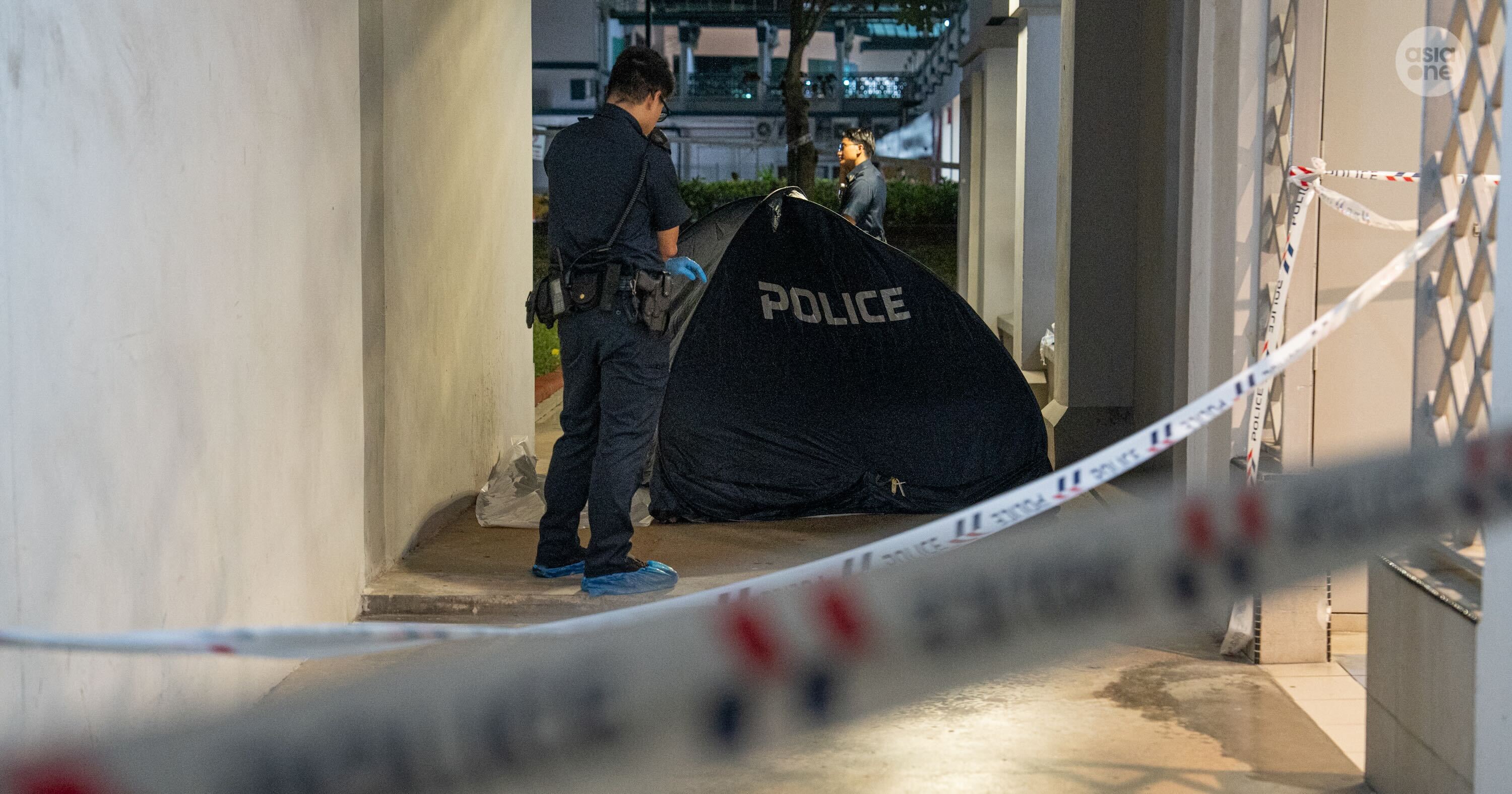 A police cordon was in place at an area off the block's lift lobby.